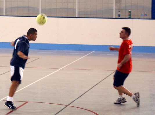GRAND FORKS AIR FORCE BASE, ND – Steven Dougherty, 319th Operations Support Squadron, performs a header, moving the soccer ball past 319th Maintenance Squadron defenders during an intramural soccer game here April 19.  OSS beat MXS, 3-0. In a later game, the 319th Medical Group bested the 319th Civil Engineer Squadron, 6-3. (U.S. Air Force photo/Senior Airman J. Paul Croxon)