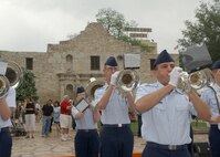The 737th Training Group Drum and Bugle Corps from Lackland Air Force Base, Texas, performs April 23 at Alamo Plaza as part of the Fiesta 2007 events. Corps members are Lackland basic military trainees who have been in the Air Force less than six weeks. (USAF photo by Alan Boedeker)                               