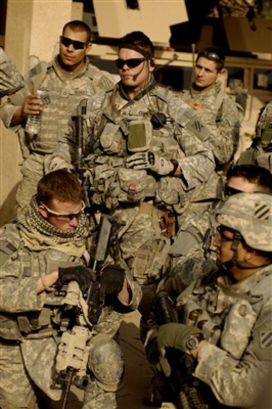 U.S. Army soldiers listen to a briefing for a search operation in Jisr Diyala, Iraq, on April, 23, 2007.  The soldiers are assigned to the 1st Battalion, 15th Infantry Regiment, 3rd Brigade Combat Team, 3rd Infantry Division.  