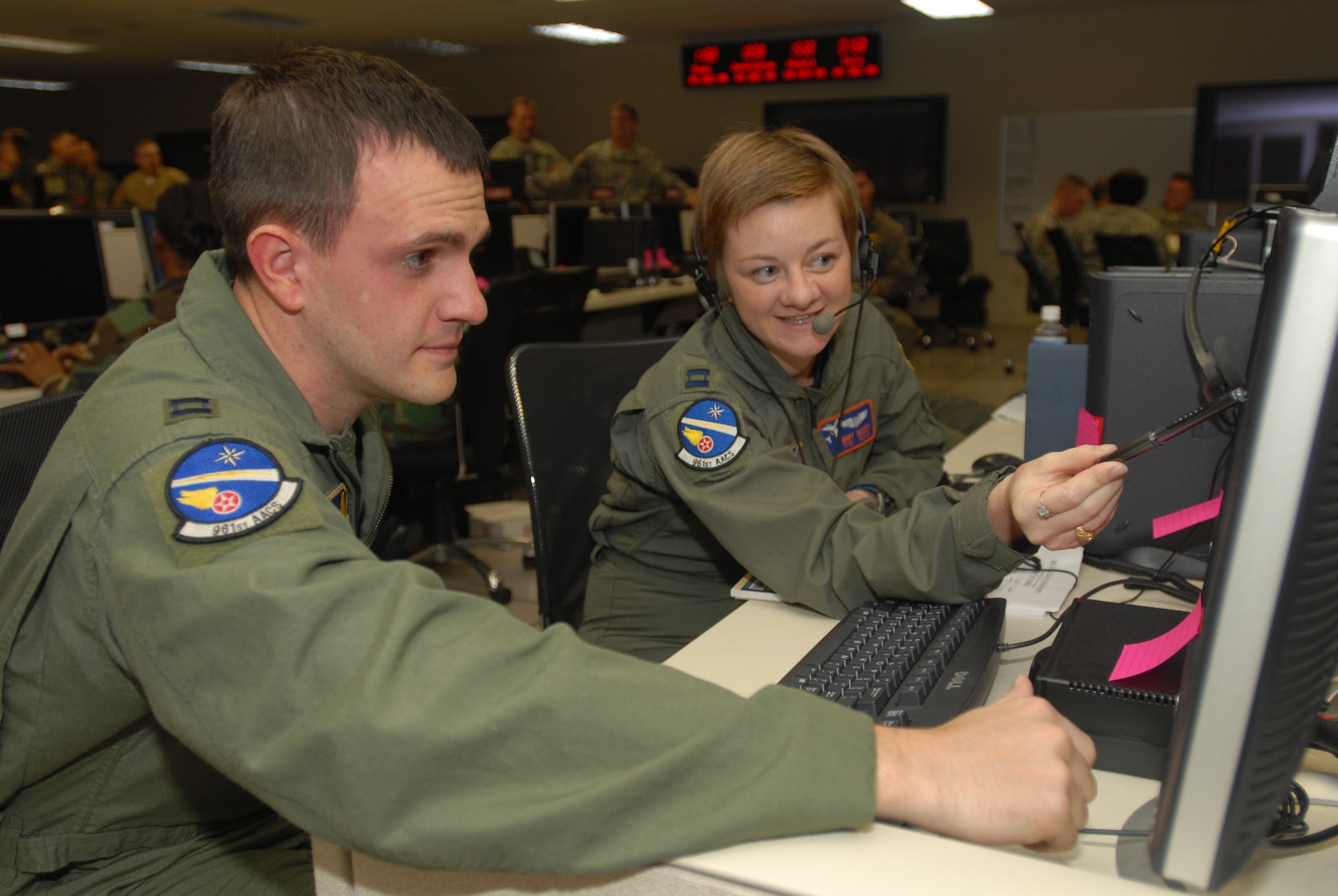 U.S. Air Force augmentees monitor air operations in the Major Richard Bong Air and Space Operations Center during a joint exercise at Hickam.  The AOC serves as the operational center for U.S. Pacific Command’s command and control of planning, execution, and assessment of air, space, and information operations across the Asia Pacific (minus Korean Theater of Operations).  U.S. Air Force photo.