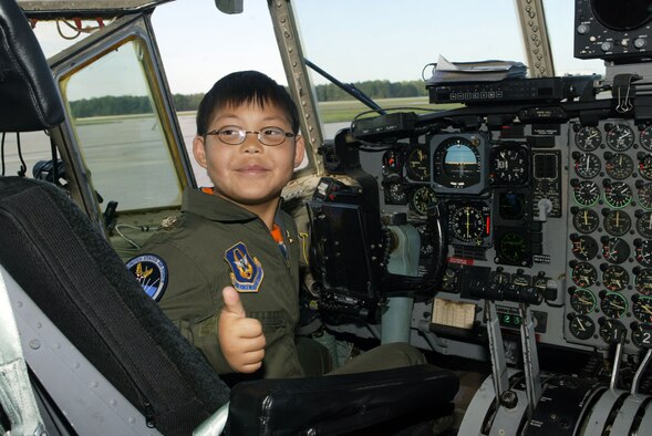 Honorary 2nd Lt. Matthew Vroman gives the thumbs up after assisting flight crews with a preflight check prior to an airdrop mission at Dobbins Air Reserve Base, Ga. Matthew has diamond blackfan anemia and visited Dobbins with the Make-A-Wish Foundation of Georgia and Alabama. (Air Force photo/Don Peek)