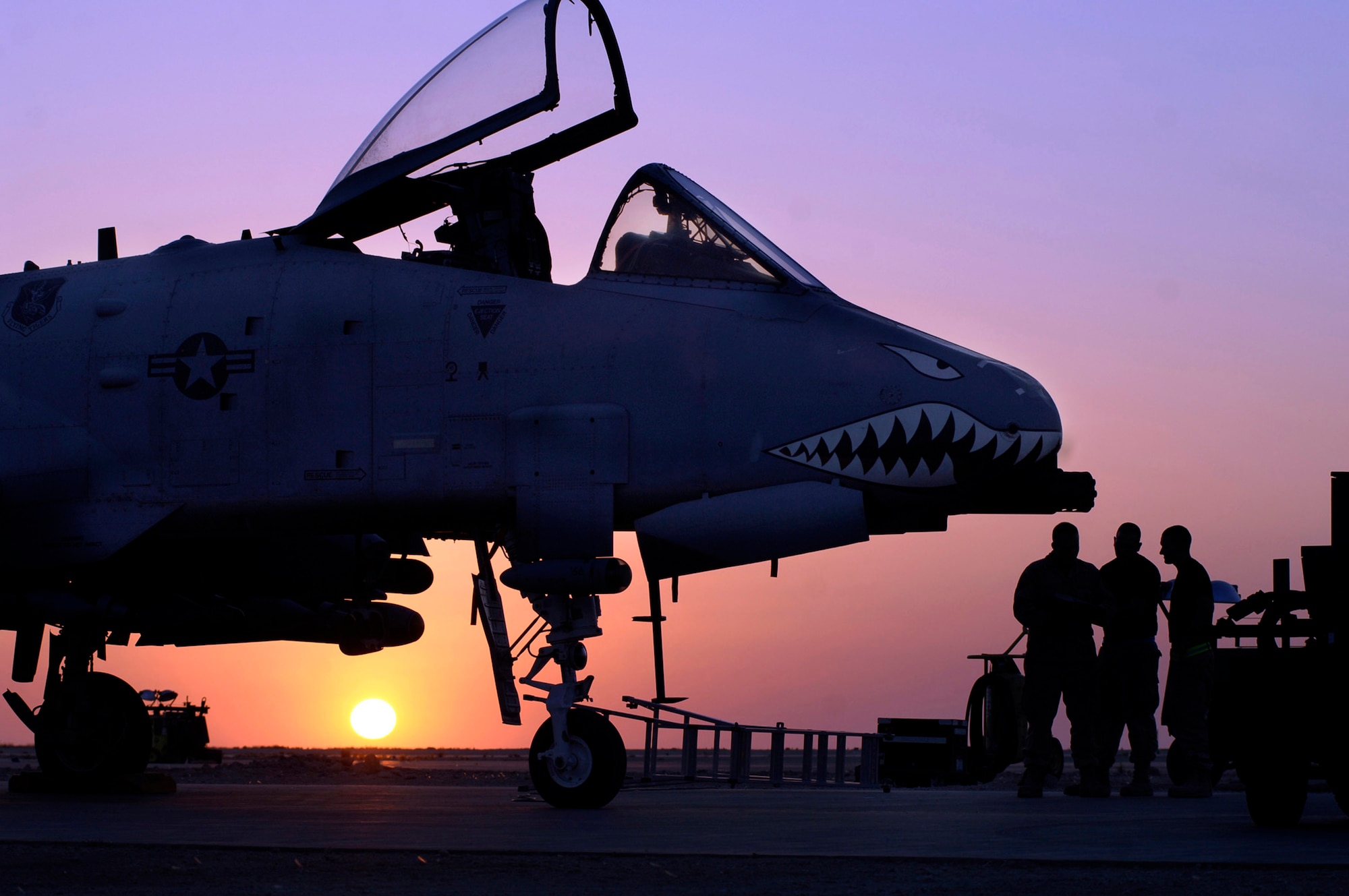 Senior Airman Joseph Cordero, Staff Sgt. Andrew House and Staff Sgt. Barrett Read trouble shoot an electronic error on an A-10 Thunderbolt II April 25 on the flightline at Al Asad Air Base, Iraq. The 438th Air Expeditionary Group A-10s perform 10 sorties daily providing top cover for ground forces in Iraq, with 900 sorties in this last four months. Airman Cordero's hometown is Beacon, N.Y. Sergeant House's hometown is Erwin, N.C. Sergeant Read's hometown is Redding, Calif. (U.S. Air Force photo/Tech. Sgt. Cecilio M. Ricardo Jr.)