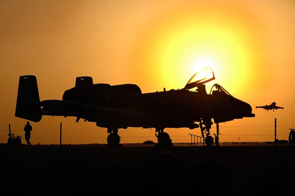 Maintenance crews on the A-10 Thunderbolt II end their 12-hour duty day April 25 at the Al Asad Air Base, Iraq. The 438th Air Expeditionary Group A-10s perform 10 sorties daily providing top cover for ground forces in Iraq, with 900 sorties in this last four months. (U.S. Air Force photo/Tech. Sgt. Cecilio M. Ricardo Jr.)