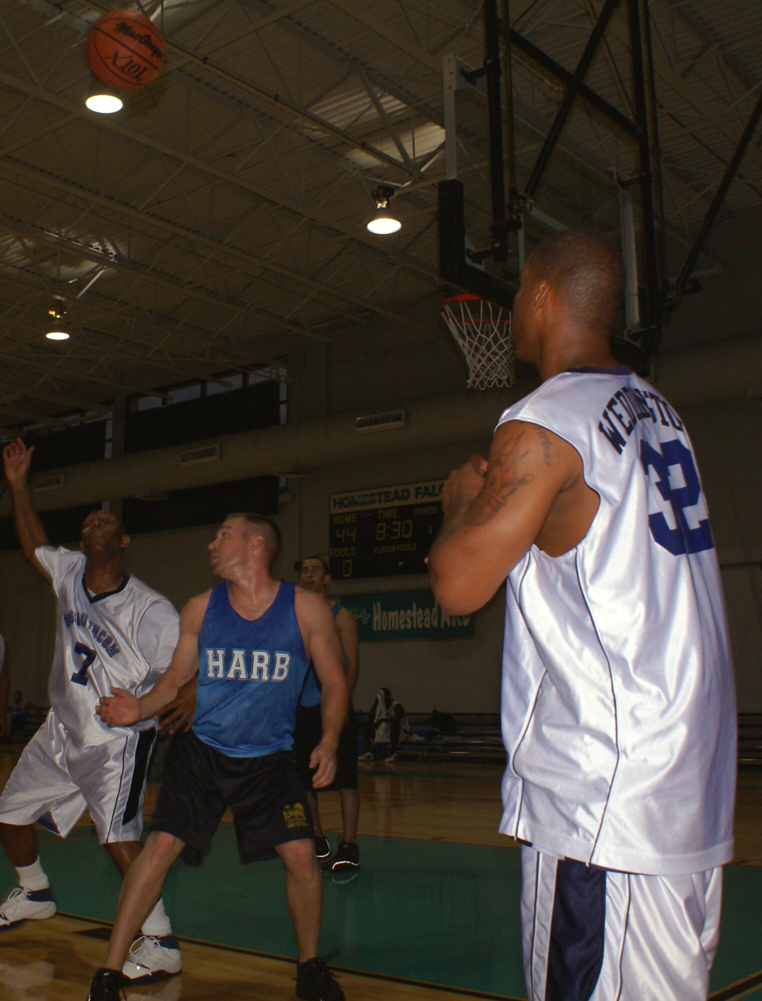 Frederick Weddington, a guard for the Southern Command B team, inbounds to teammate David “DC” Campbell during a recent basketball game at Homestead Air Reserve Base, Fla.   Southern Command is represented by two teams in the Homestead’s intramural basketball league, and both teams finished the regular season with a record of five wins and one loss.  The playoffs begin the week of April 30 with the teams from Southern Command ranked as the top two seeds out of seven teams. (U.S. Air Force photo/Jake Shaw)