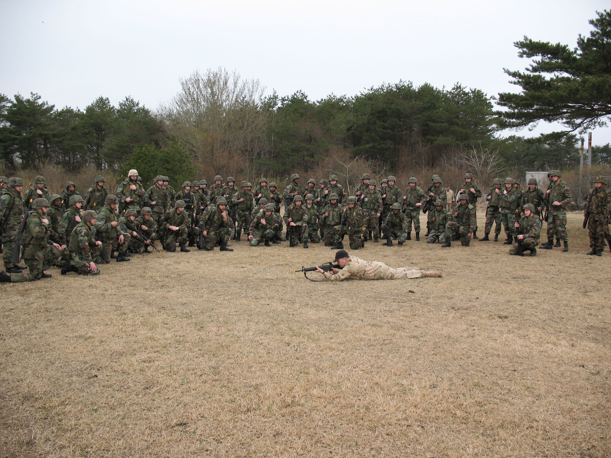 Airmen learn the proper way to fire an M-16 rifle laying in the prone position during a field training exercise April 25 at Misawa Air Base, Japan. Most of these Misawa AB Airmen are deploying in the next air expeditionary force cycle, and to prepare they attended expeditionary combat skills training. (U.S. Air Force photo/Senior Airman Gena Armstrong) 
