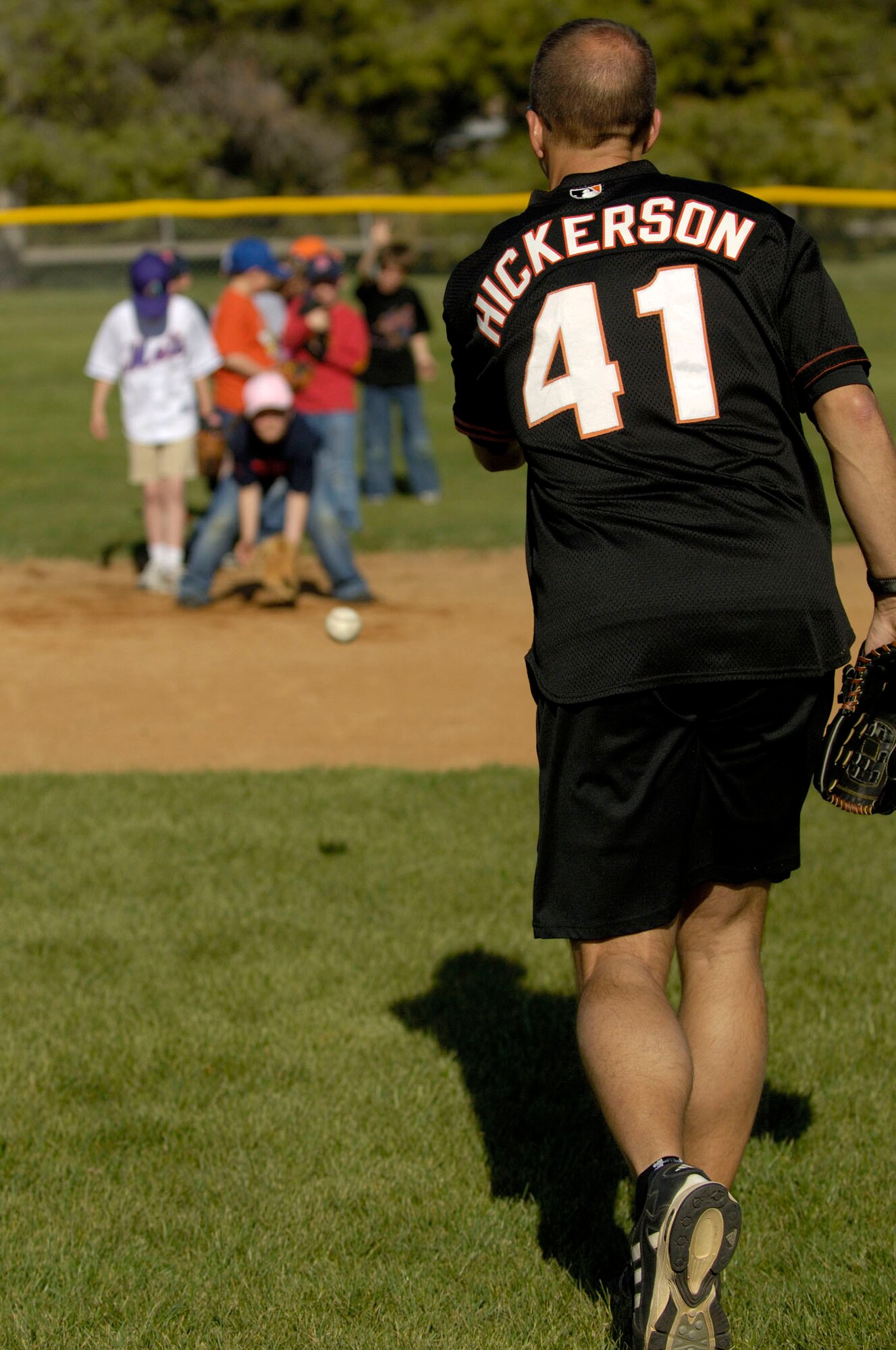 MOUNTAIN HOME AIR FORCE BASE, Idaho -- Bryan Hickerson, former professional MLB player and head of Unlimited Potential Incorporated, teaches children the fundamentals of baseball at Hamlett Field here April 24.  Mr. Hickerson is one of five former professional athletes who visited the base to volunteer their time and share their faith with Airmen and their families here.  Air Force photo by Airman 1st Class Ryan Crane