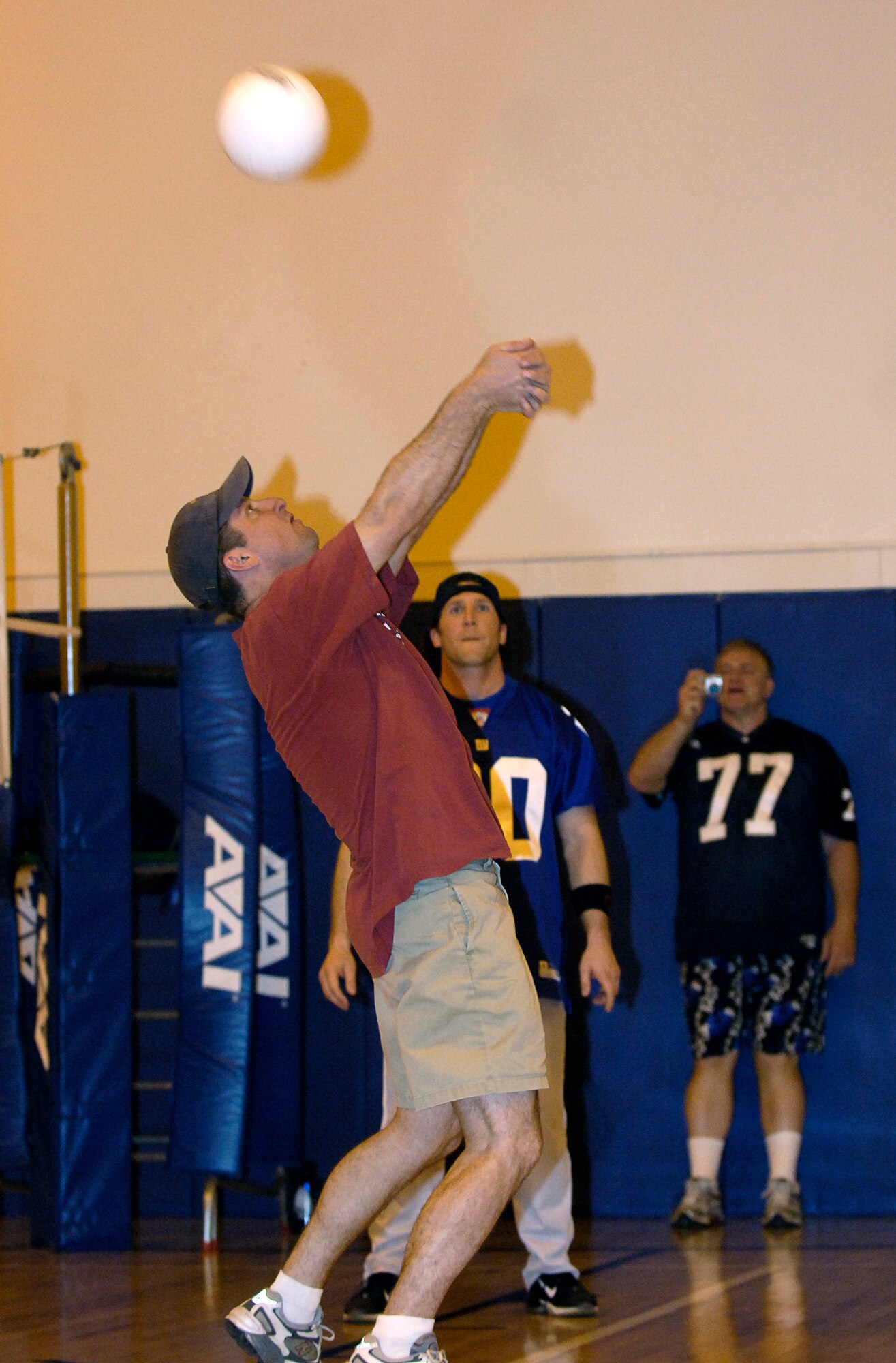 MOUNTAIN HOME AIR FORCE BASE, Idaho -- Chaplain Samuel Smith, base chapel, bumps the ball during a volleyball game with four former professional athletes at the fitness center here April 25. The chiefs and first sergeants won two of three games against the athletes and chaplains. The athletes visited the base April 23 to 26 to volunteer their time and share their faith with Airmen and their families. Air Force photo by Airman 1st Class Ryan Crane