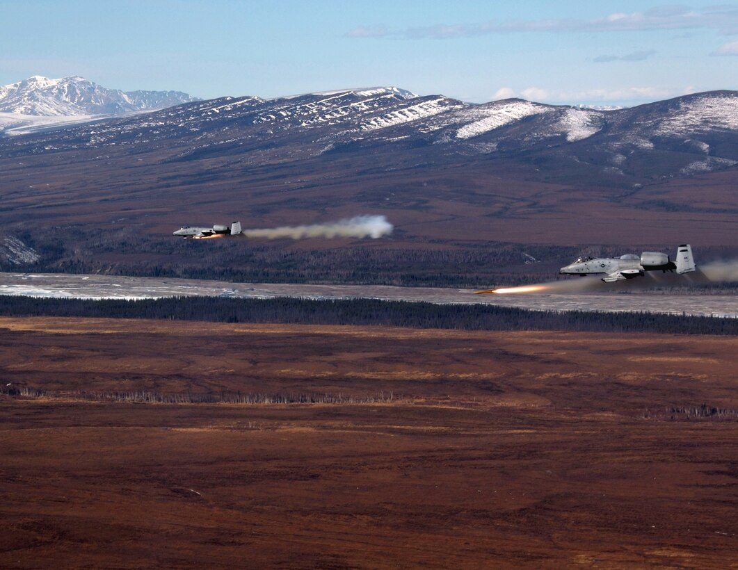 Two A-10 Thunderbolt IIs fire AGM-65 Maverick missiles over the Pacific Alaska Range Complex April 24 during live-fire training. The A-10s are from the 355th Fighter Squadron from Eielson Air Force Base, Alaska. Members from the 355th FS are tasked to provide mission ready A-10s and a search and rescue capability, in Alaska and deployed sites worldwide. (U.S. Air Force photo/Master Sgt. Robert Wieland) 