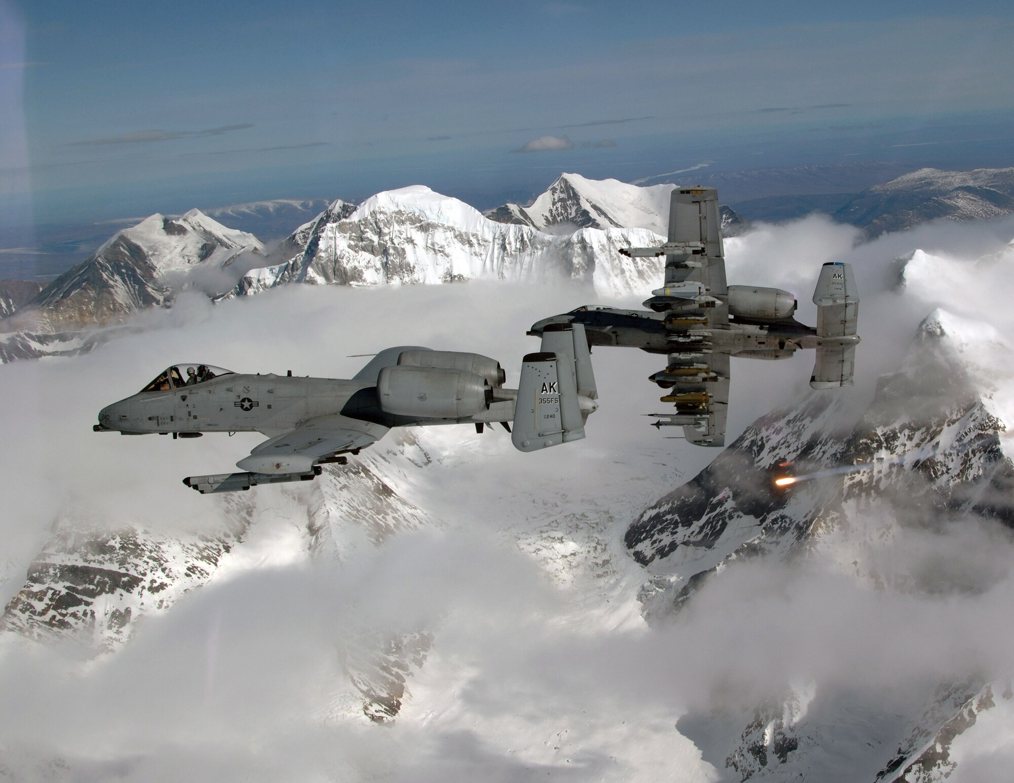 A-10 Thunderbolt IIs break over the Pacific Alaska Range Complex and one aircraft drops a flare during live-fire training April 24. The A-10s are from the 355th Fighter Squadron at Eielson Air Force Base, Alaska. Members from the 355th FS are tasked to provide mission ready A-10s, as well as search and rescue capability in Alaska and deployed sites worldwide. (U.S. Air Force photo/Master Sgt. Robert Wieland)
