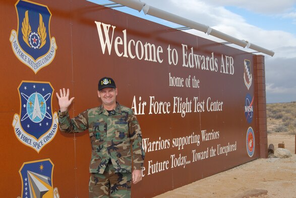 Col. H. Brent Baker Sr., the former 95th Air Base Wing commander, bids goodbye to Edwards at the North Gate sign April 16. Colonel Baker was selected to lead the Global Logistics Support Center and departed Edwards on Wednesday. While wing commander, he focused his leadership on three goals: prepare Air Expeditionary Force-ready Airmen, make Edwards a great place to live and work, and embrace change and be "masters of our own destiny." (Photo by Senior Airman Jason Hernandez)
