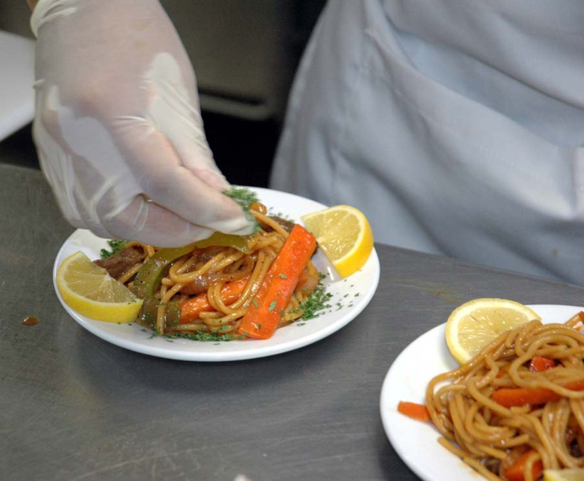 During the Chef of the Quarter competition, the three competing chefs prepared individual meals for the judges to sample. (U.S. Air Force photo by Staff Sgt. Sam House)