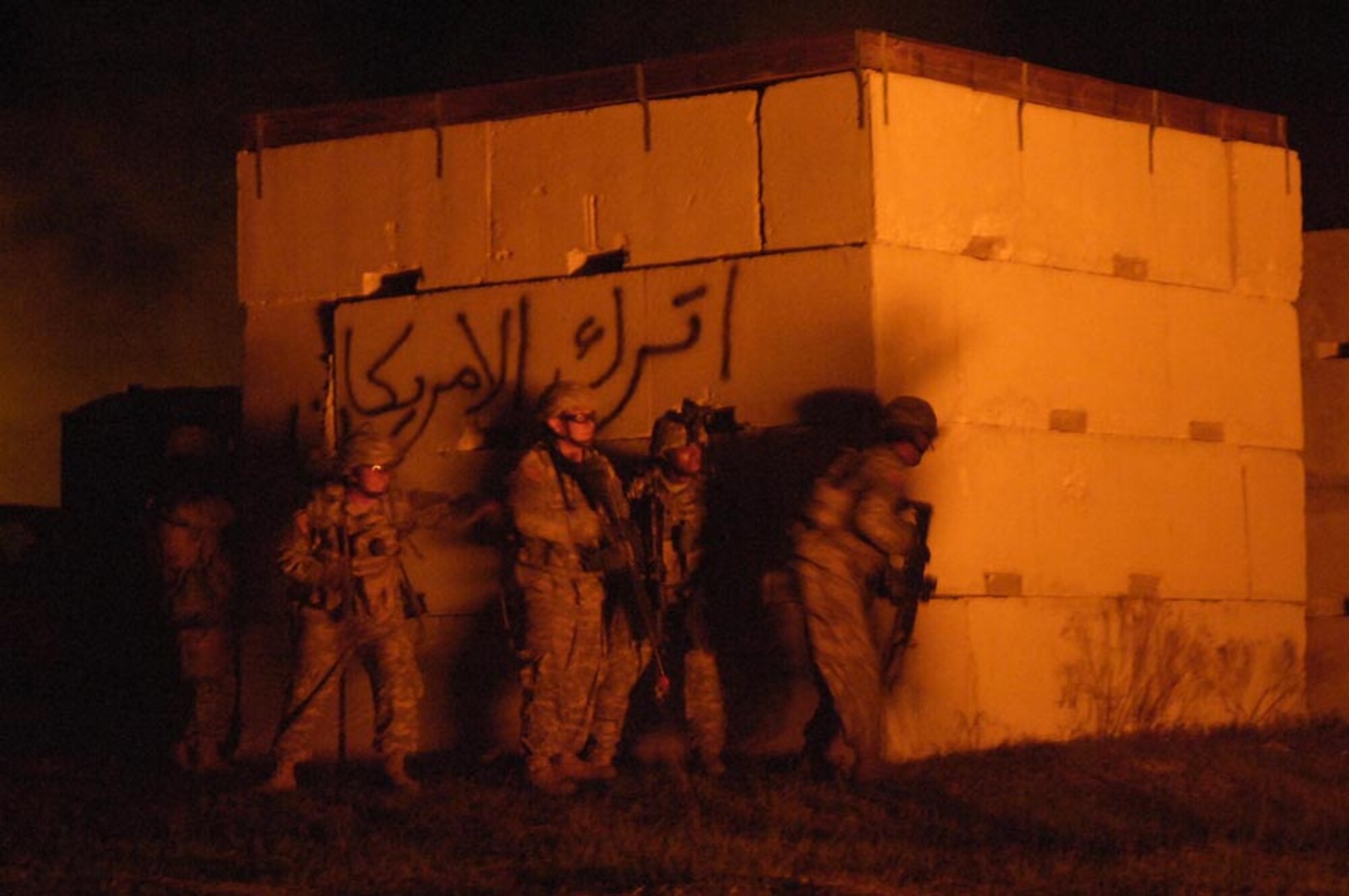 Army soldiers from Scout Platoon 3-67 AR, 4th ID, Ft. Hood, Texas, move quickly to clear buildings of opposition forces during Atlantic Strike V April 18, 2007. Atlantic Strike is a joint forces training event involving joint terminal attack controllers from the Army, Air Force and Marines  and is held semi-annually at Avon Park Air Ground training Complex, Avon Park, Fla. (U.S. Air Force photo by Staff Sgt. Stephen Otero)