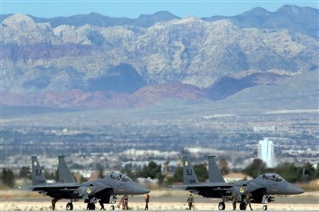 Two F-15E Strike Eagles prepare to launch in support of Exercise Green Flag at Nellis Air Force Base, Nev., April 24, 2007. During Green Flag, aircrews practiced employing airpower within an irregular warfare environment. 