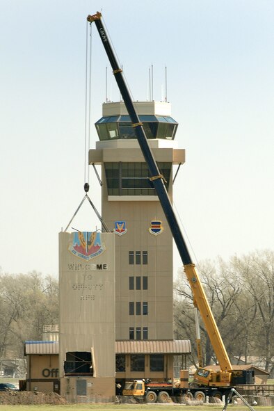 OFFUTT AIR FORCE BASE, Neb. -- A crane prepares to remove a portion of the old air traffic control tower April 21. The remainder of the old tower was dismantled by early afternoon. A ribbon cutting for the new air traffic control tower is scheduled for 11 a.m. May 9. (U.S. Air Force Photo by Josh Plueger)