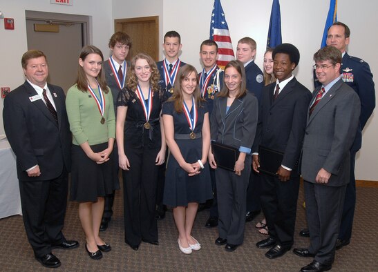 OFFUTT AIR FORCE BASE, Neb. -- Back row, left to right: Colin Sorenson, bronze medal winner; Kevin Watson, silver and gold medal winner; Brian Watson, silver and gold medal winner; Nicholas Szczepaniak, silver certificate winner; Jamie Fields, bronze certificate winner; and Col. Jim Jones, 55th Wing commander.
Front row, left to right: Dr. John Deegan, Bellevue Public Schools superintendent; Emily Edwards, bronze medal winner; Catherine Buennemeyer, bronze medal winner; Christine Baude, bronze medal winner; Laura Van Epps, silver certificate winner; Wayne Banks, silver certificate winner; and Congressman Lee Terry, Nebraska’s 2nd District. (U.S. Air Force Photo by Josh Plueger)