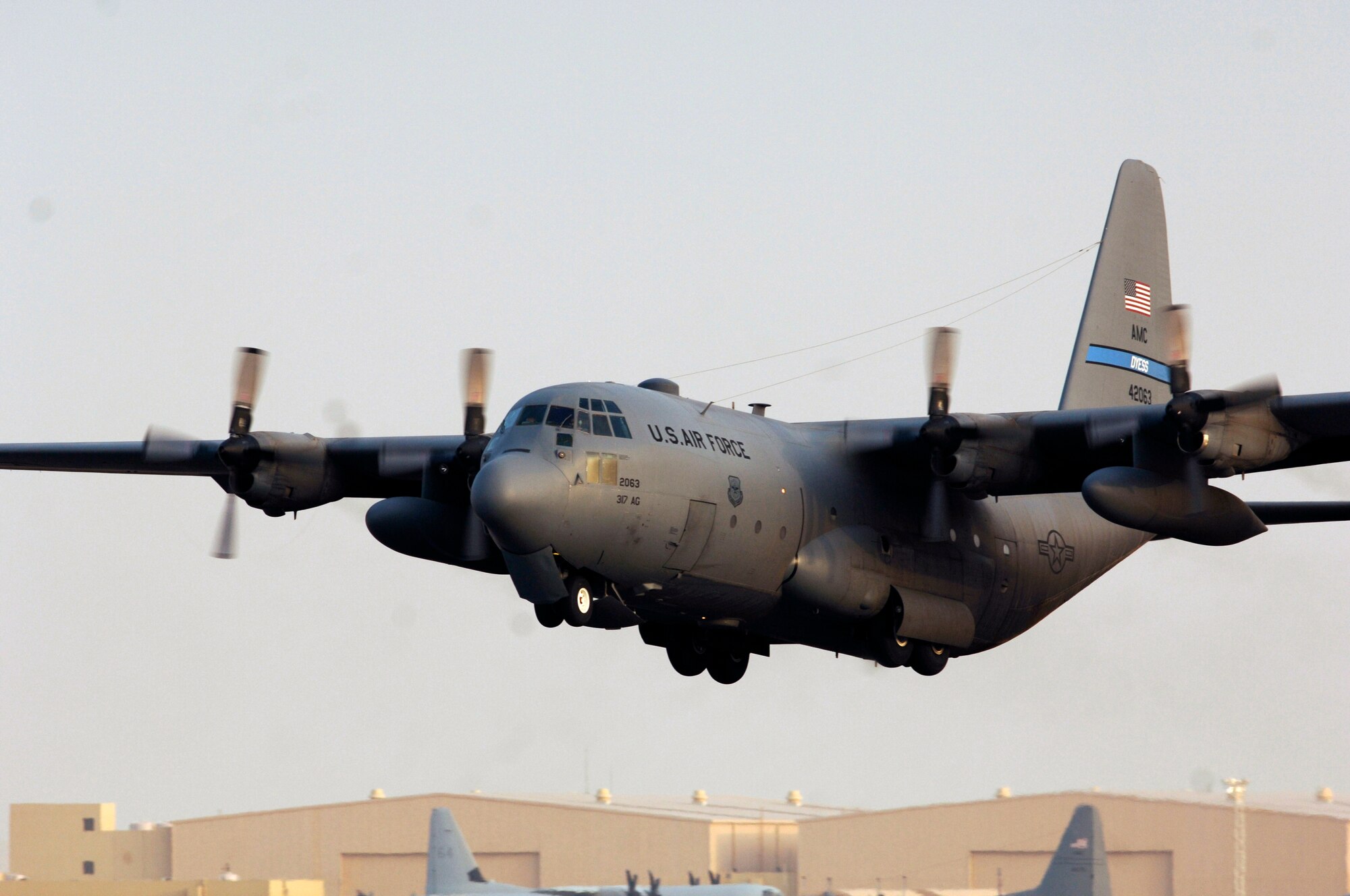 A C-130 Hercules takes off from an air base in Southwest Asia in support of operations in Iraq. Using its aft loading ramp, the C-130 can accommodate a wide variety of oversized cargo, including everything from utility helicopters and six-wheeled armored vehicles to standard palletized cargo and military personnel. In an aerial delivery role, it can airdrop loads up to 42,000 pounds or land and deliver cargo on rough, dirt strips.  (U.S. Air Force photo/Tech. Sgt. Cecilio M. Ricardo Jr.)   
