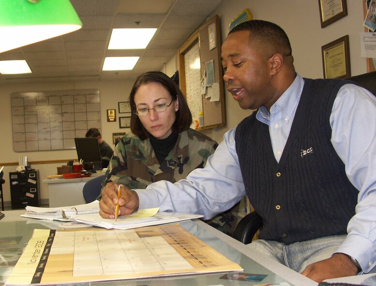 Marlon Crawford, 932nd Airlift Wing education office, counsels a team member on educational opportunities for the Air Force Reserve.  Photo/TSgt. Dan Oliver