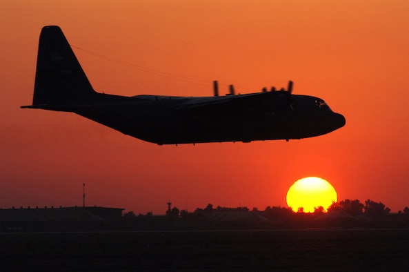 BALAD AIR BASE, Iraq -- A U.S. Air Force C-130 Hercules assigned to the  777th Expeditionary Airlift Squadron here takes off into the sunset. Balad personnel can expect to see temperatures hit 100 degrees regularly by the end of May, with temperatures reaching as high as 120 degrees in the summer months. (U.S. Air Force photo/Staff Sgt. Michael R. Holzworth) 