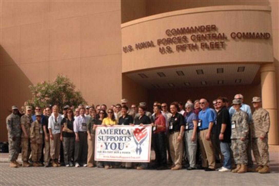 Members of the Joint Civilian Orientation Conference 73, pose for a group photo in front of the U.S. Naval Central Command's headquarters building in Bahrain, April 26, 2007. During the tour the group learned about NAVCENT's ongoing operations and responsibilities in the region. 