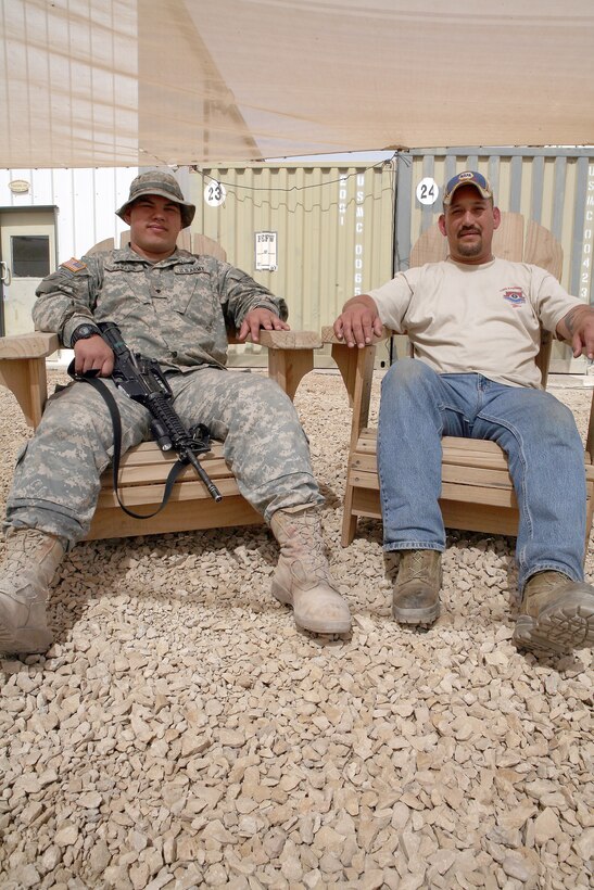 AL ASAD, Iraq - Spc. Marcos Zavala, a heavy equipment operator with the 618th Airborne Engineers Company, and his father, Roberto, a sheet metal mechanic with the Al Asad Fleet Readiness Center, were able to spend about a week together.
