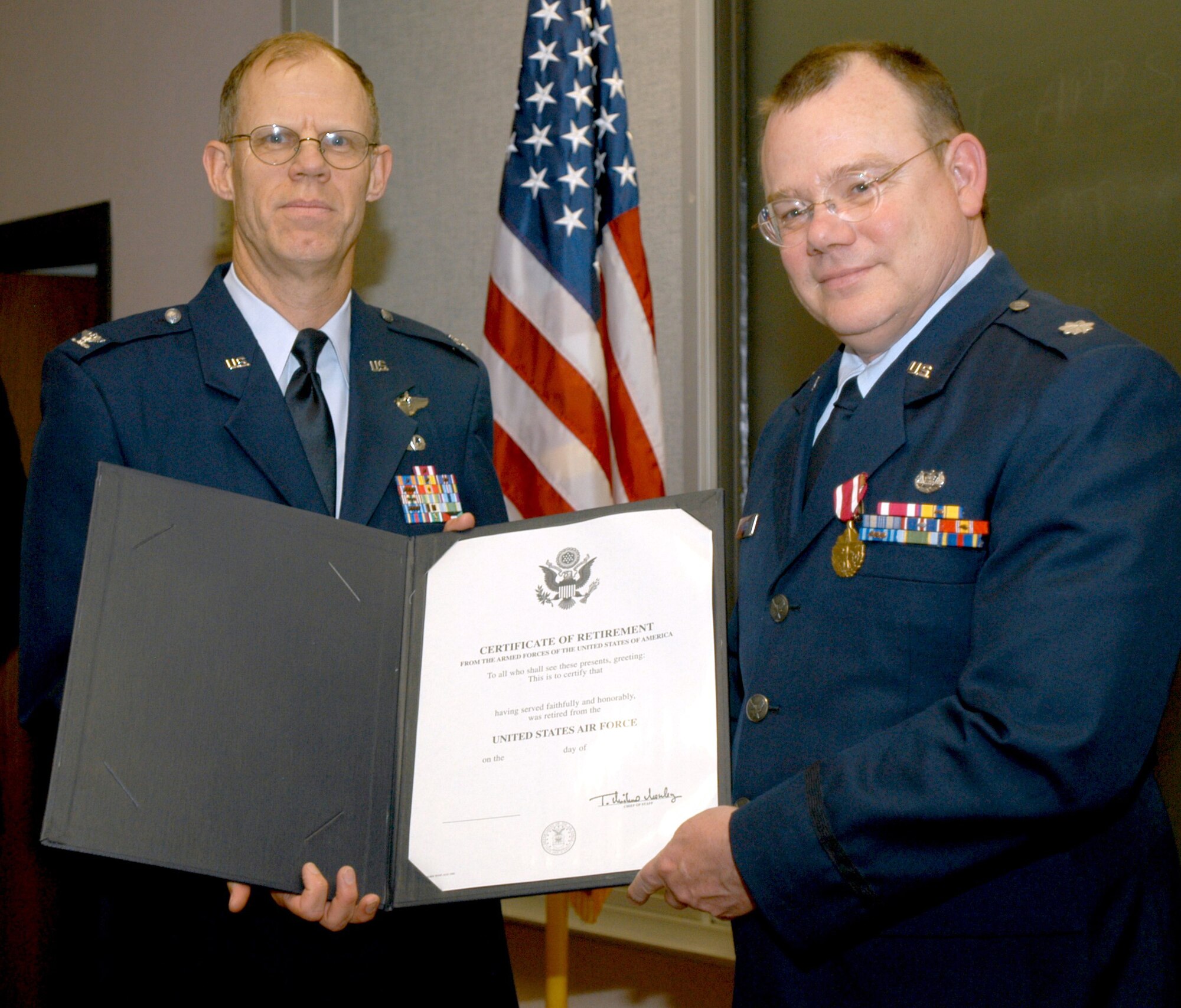 GRISSOM AIR RESERVE BASE, Ind, -- Lt. Col. Richard Phillips, 434th Air Refueling Wing staff judge advocate (right), receives his retirement certificate from Col. Kerry Keithcart, 434th Air Refueling Wing vice commander, during a special retirment ceremony held  recently at Grissom.  (Air Force photo/ Senior Airman Chris Bolen)