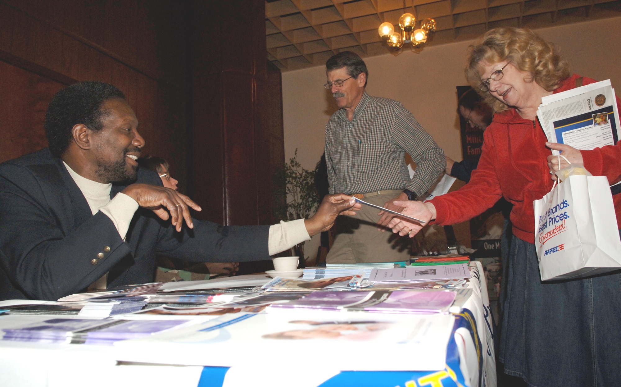 FAIRCHILD AIR FORCE BASE, Wash. -- Stephen Pitters, 92nd Medical Operations Squadron social worker, shares information on behavioral health to military retirees during Retiree Appreciation Day at Club Fairchild April 24. Mr. Pitters works at the family advocacy center at Fairchild. (U.S. Air Force photo/Airman 1st Class Nancy Hooks)