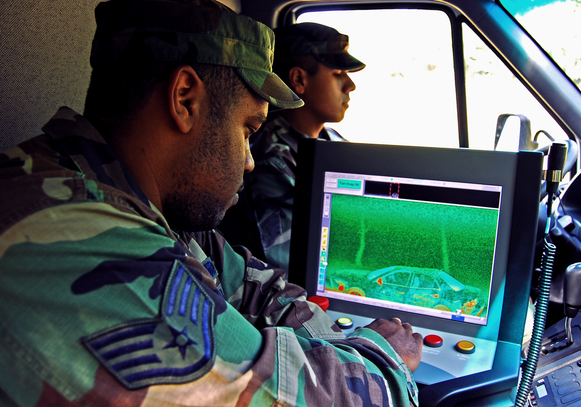 Staff Sgt. Jonathan Hobbs uses a Z backscatter van to scan a suspect vehicle during a training exercise April 23 at Moody Air Force Base, Ga. The 820th Security Forces Group owns two of the $1.2 million vehicles, which interpret reflected X-rays to create highly detailed images of low-density materials such as explosives or drugs. Sergeant Hobbs is an 820th SFG sensor technician. (U.S. Air Force photo/Tech. Sgt. Parker Gyokeres) 
