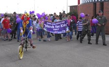 MINOT AIR FORCE BASE, N.D. – Children and adults start off the 10th annual Kid’s March April 27 at J.R. Rockers as Month of the Military Child comes to an end. The march was followed by a block party that included games, crafts and more. (U.S. Air Force photo by Airman 1st Class Joe Rivera)