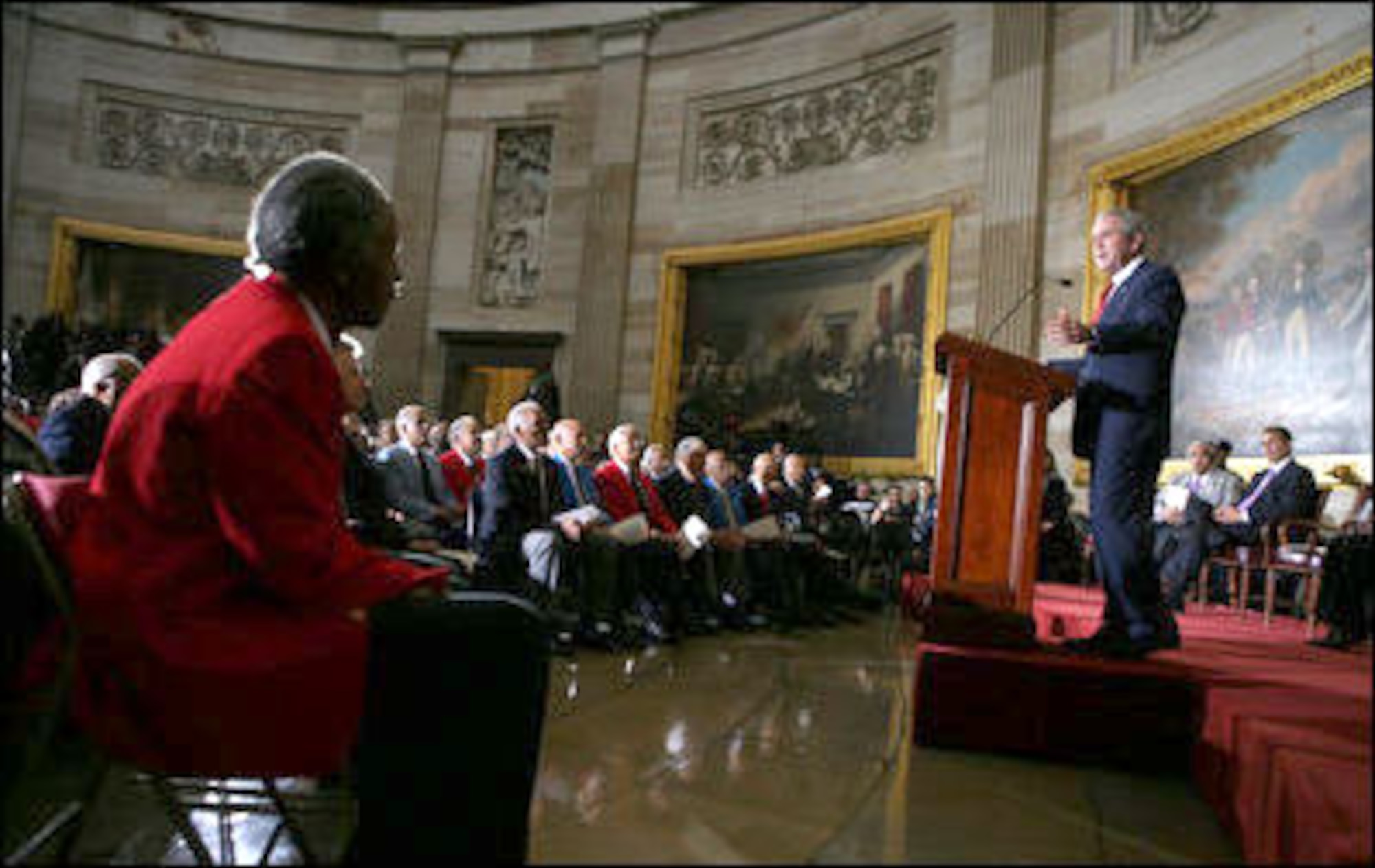 President George W. Bush speaks during the Congressional Gold Medal ceremony for the Tuskegee Airmen Thursday, March 29, 2007, at the U.S. Capitol. Said the President, “The Tuskegee Airmen helped win a war, and you helped change our nation for the better. Yours is the story of the human spirit, and it ends like all great stories do – with wisdom and lessons and hope for tomorrow.” White House photo by Eric Draper

