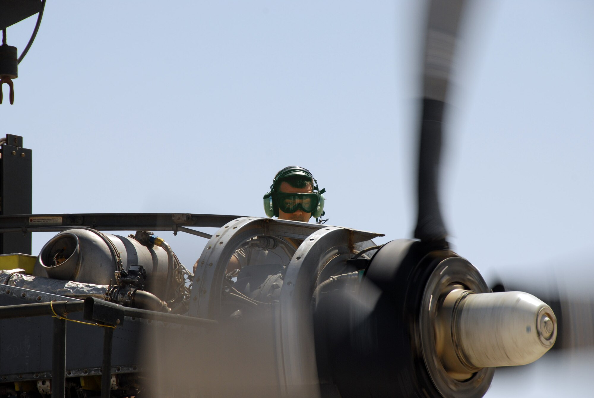 Senior Airman Ryan Overdorff tests a newly repaired C-130 Hercules engine April 24 at an air base in Southwest Asia.  Airman Overdorff is a maintenance journeyman with the 379th Expeditionary Maintenance Squadron propulsion flight.  Airmen from the flight repair engines sent in from throughout the Central Command area of responsibility. (U.S. Air Force photo/Airman 1st Class Gustavo Gonzalez)