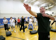 Pete Hardy, head instructor at Krav Maga Regional Training Center, teaches Team Lackland members some basic Krav Maga techniques during a free workshop conducted April 19 at the Chaparral Fitness Center on Lackland Air Force Base, Texas. The clinic was in observance of Sexual Assault Awareness Month. Krav Maga is touted as a street and battlefield proven self-defense system. (USAF photo by Robbin Cresswell)