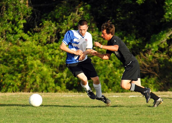 EGLIN AIR FORCE BASE, Fla. - Spencer Manchester, 96th Civil Engineer Group, battles with Aron VanHyning, 33rd Fighter Wing, during the 2007 intramural soccer championship game. The 33rd FW emerged victorious over the 96th CEG, the current reigning champs, ending the game with a 4-1 win. (U.S. Air Force photo by Will VanderMate)