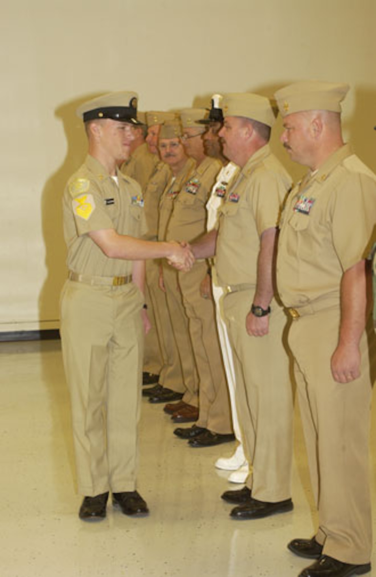 Cody Blackshear shakes hands with various other chief petty officers after being promoted to chief petty officer himself, but within the U.S. Naval Sea Cadet Corps.
Cody was being promoted to chief petty officer within the U.S. Naval Sea Cadet Corps, located at March Air Reserve Base. (U.S. Air Force photo by SSgt Amy Abbott, 452 AMW/PA)
