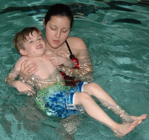 Catherine Desautels, 28th Services Squadron lifeguard, instructs Brady Riker on Level 1 swimming during a recent lesson held at the Bellamy Fitness Center indoor pool here.  The fitness center offers instruction is swimming skills, water safety and basic water rescue.  (U.S. Air Force photo/Tech. Sgt. Todd Wivell)