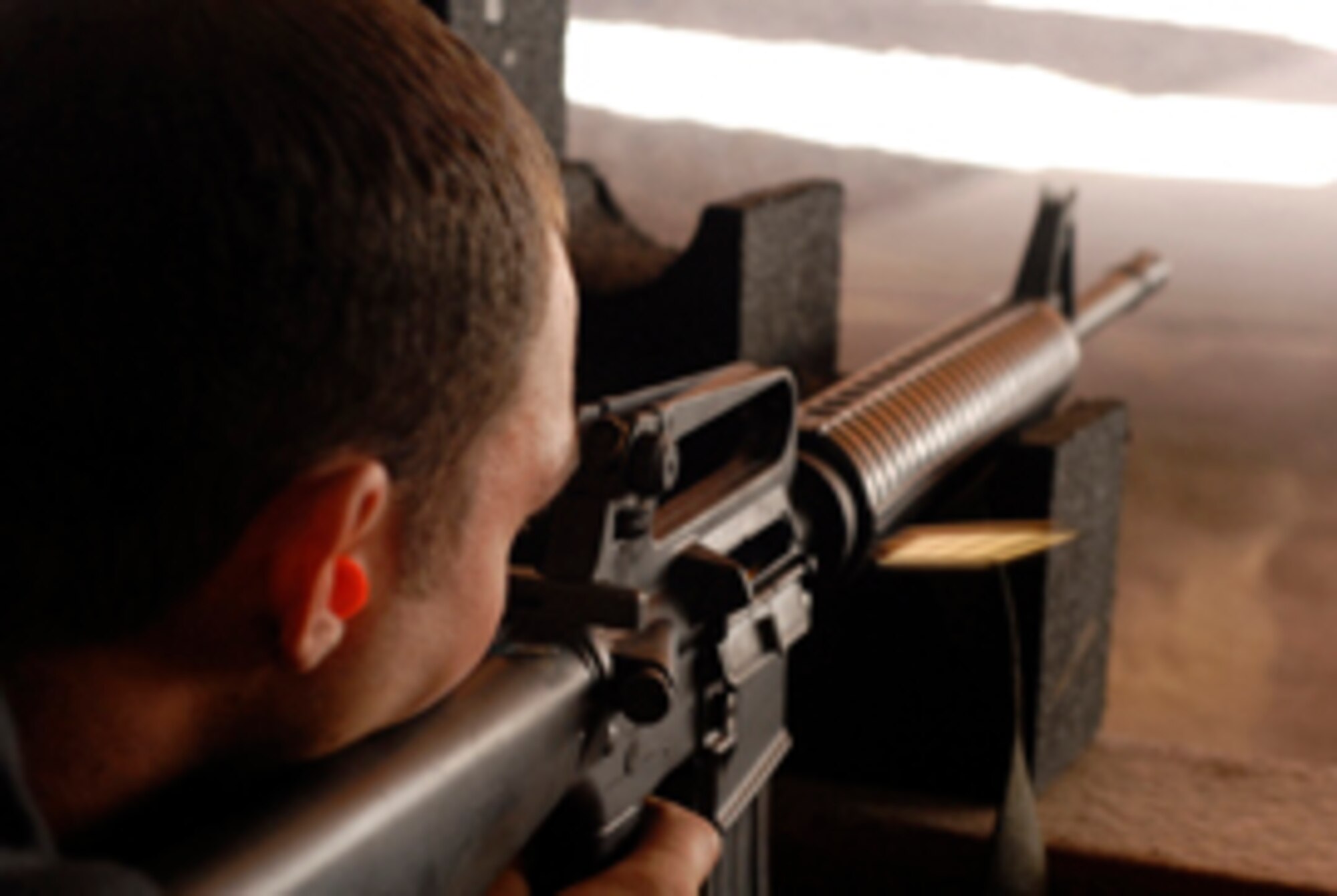 Senior Airman Duane Gross, 756th Aircraft Maintenance Squadron weapons maintenance crew member, fires his M-16 during a tactical rifle qualification course.  (Photo by Senior Airman Christopher Hummel)