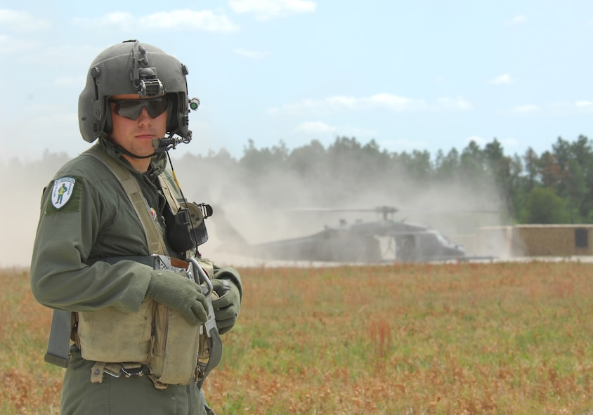 MOODY AIR FORCE BASE, Ga. -- Airman Chris Clark, a HH-60G Pave Hawk aerial gunner with the 41st Rescue Squadron at Moody Air Force Base, stands near an exercise landing site at the Grand Bay Training Range April 25.  Moody aircrews train constantly for combat rescues in nearly every environment. (U.S. Air Force photo by Senior Airman Angelita Lawrence)