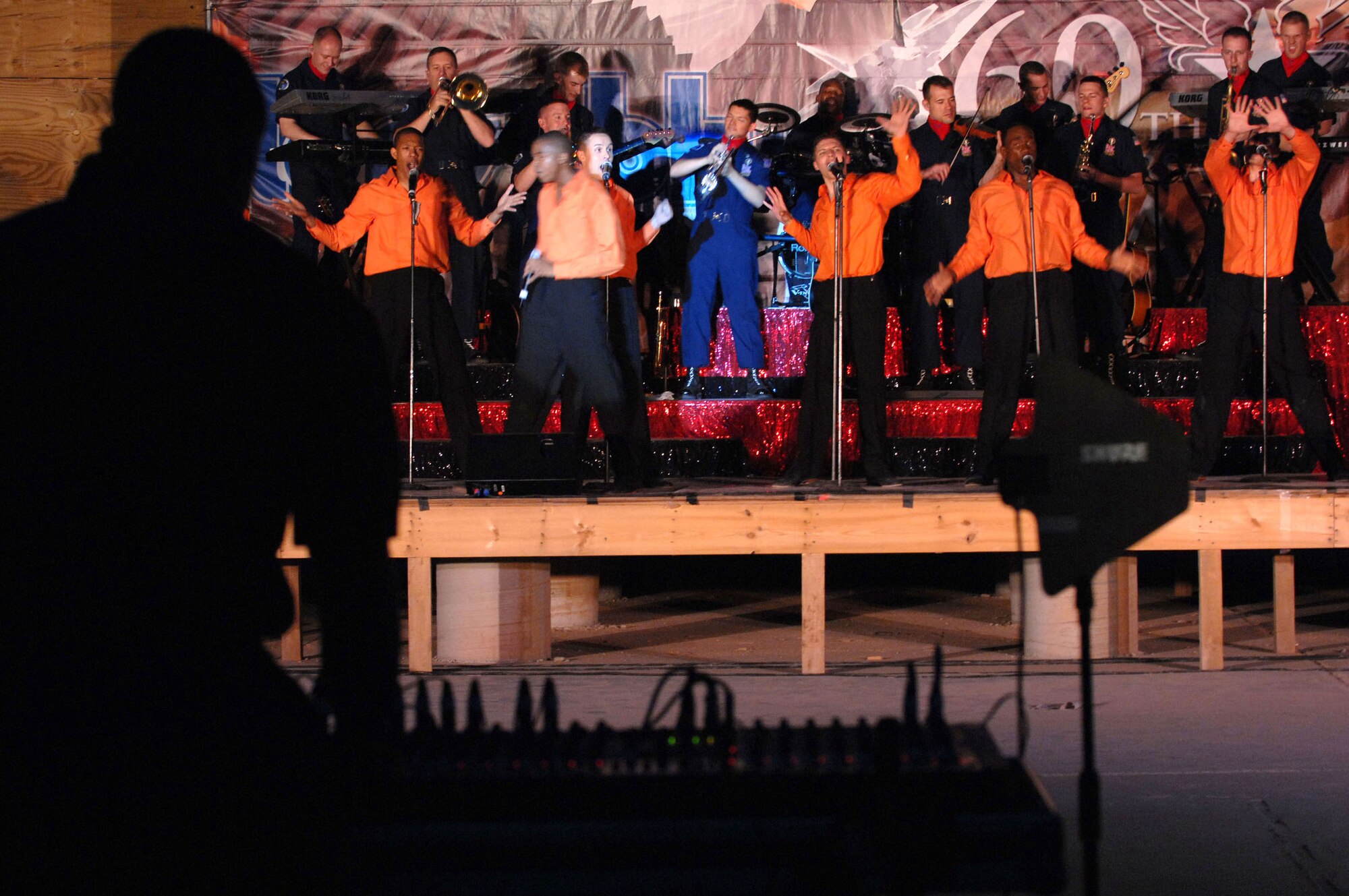 Tops in Blue members perform for Airmen and Soldiers April 26 at Kirkuk Air Base, Iraq. Tops in Blue's goal is to enhance mission productivity for Air Force members around the world. Tops In Blue Airmen perform an average of 120 performances at 100 locations worldwide each year. (U.S. Air Force photo/Senior Airman Bradley A. Lail) 
