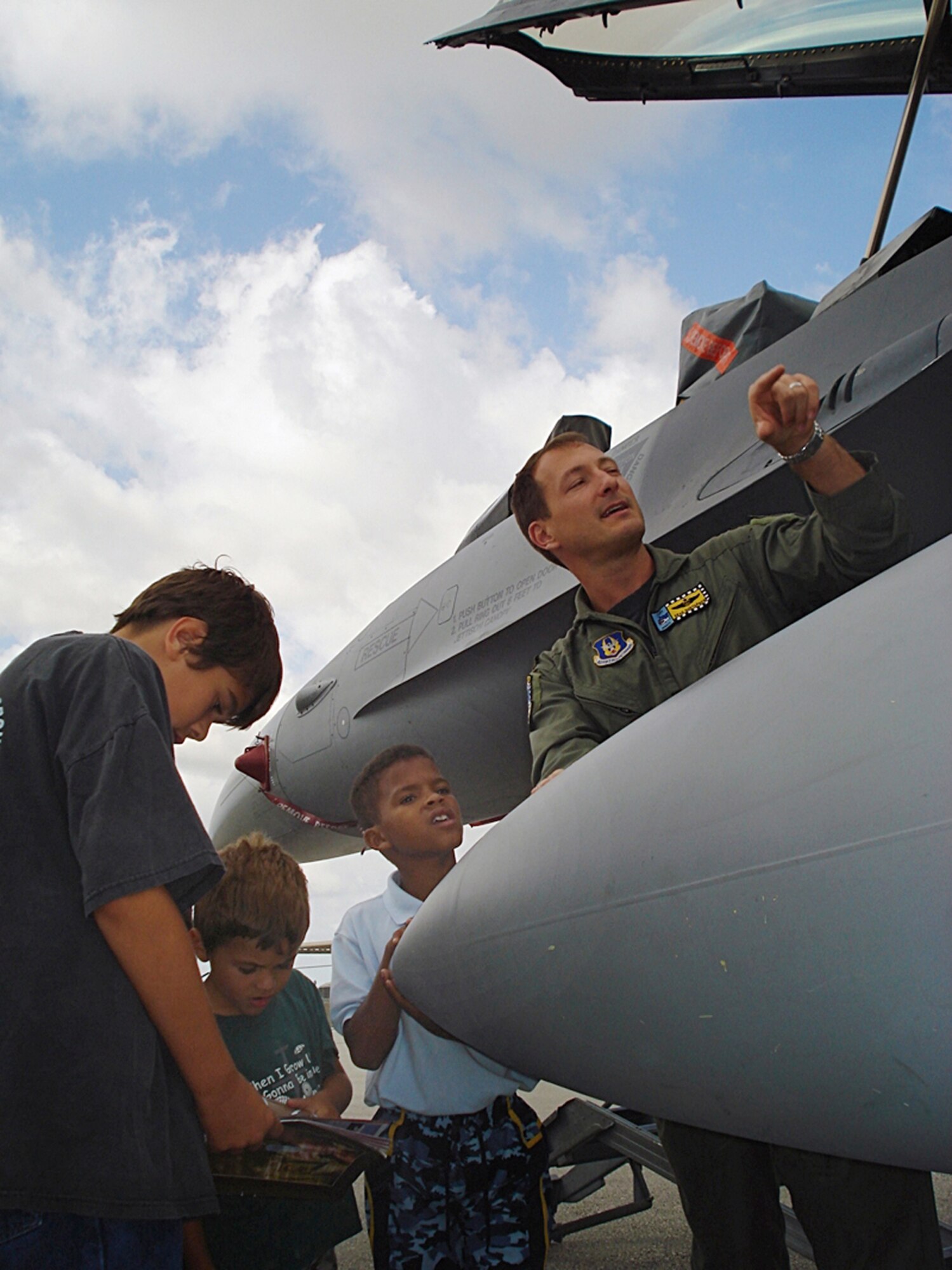 Homestead Air Reserve Base was busier than normal April 26 when more than 100 children spent the day here with parents as part of the annual Take Your Child to Work Day.  The event offered an opportunity for children to spend the day with their parent in their workplace, learning about what mom or dad does all day, as well as having the chance to peer into possible career opportunities for their own futures.  During the day children and parents were treated to a parachute-rigging demonstration courtesy of the soldiers at Special Operations Command South, followed by a tour of a B-52 Stratofortress heavy bomber plane.  The day concluded with the children visiting the 93rd Fighter Squadron, where Maj. Sean “Stroker” Gustafson, an F-16 fighter pilot, gave the kids a tour of an F-16. (U.S. Air Force photo/Jake Shaw)