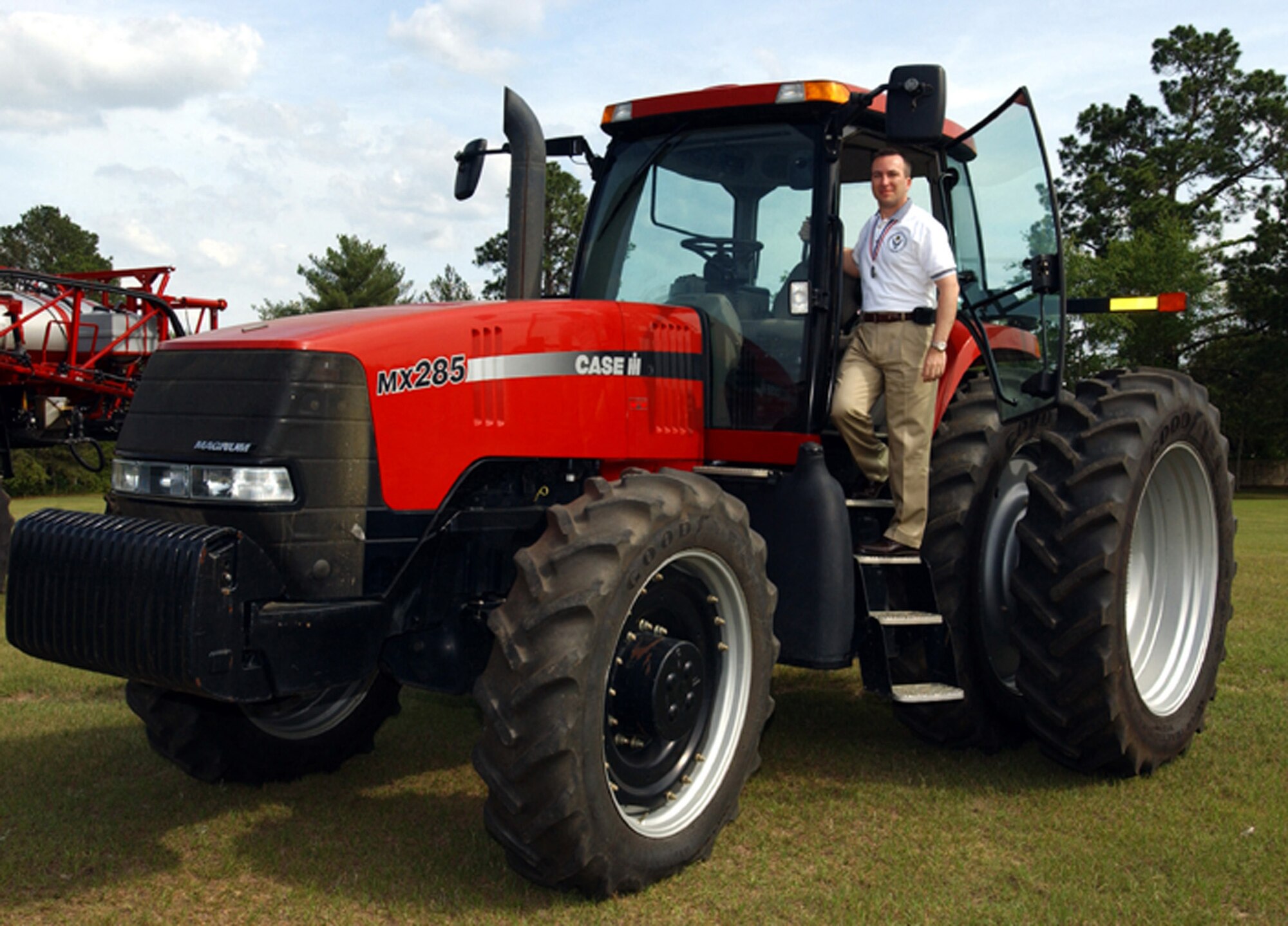 Senior Master Sgt. Ronald Colaninno, 2006 Outstanding Airmen/First Sergeant of the Year winner in the senior NCO category tests his skills driving a tractor in Georgia.  Sergeant Colaninno, is the NCO in charge of training with the 514th Security Forces Squadron, McGuire Air Force Base, NJ. (U.S. Air Force photo/Senior Master Sgt. Elaine Mayo)
