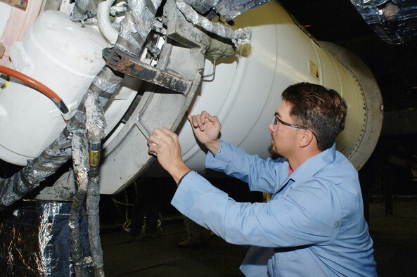 Shane Thornley, J-6 outside machinist who has been at AEDC for three months, is from Hilo, Hawaii.  Thornley currently lives in Woodbury. He is removing the protective tape covering the roll control exhaust nozzles.