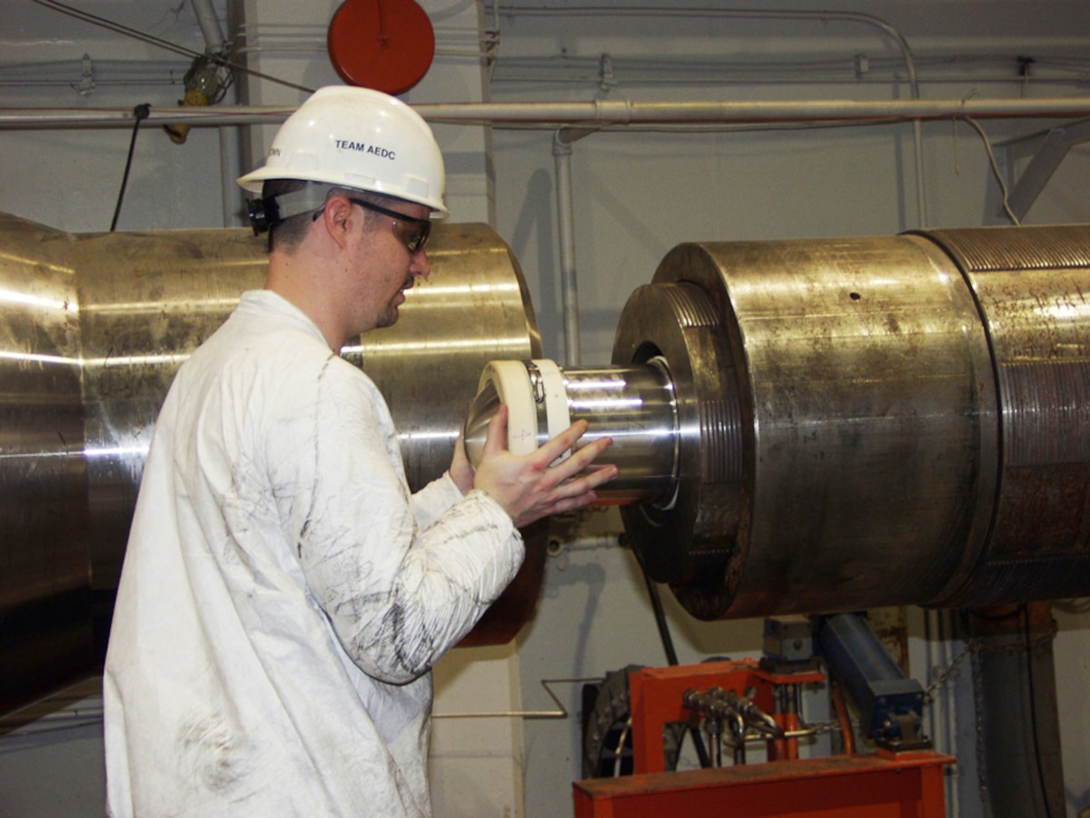 David Brown, an ATA outside machinist, loads a high fidelity projectile into the barrel of a two-stage gas gun at the center’s Hypervelocity Ballistic G-Range during recent ongoing high-velocity impact testing.
