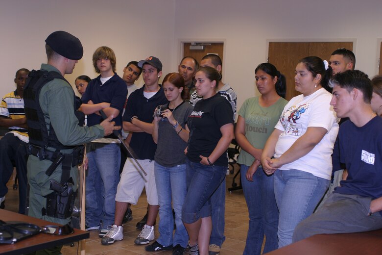 The 482nd Security Forces Squadron at Homestead Air Reserve Base offered “Share the Passion” visitors a chance to get up close and personal with some of the equipment and tactics security forces Airmen use in their day-to-day and combat operations duties.  The Airmen demonstrated crowd control techniques and capabilities of various weapons during their portion of the event. Guests also toured other major operational areas of the base, watched F-16s launch and witnessed an enlistment ceremony during the visit to the base.  (U.S. Air Force photo/Tech. Sgt. Paul Dean)
