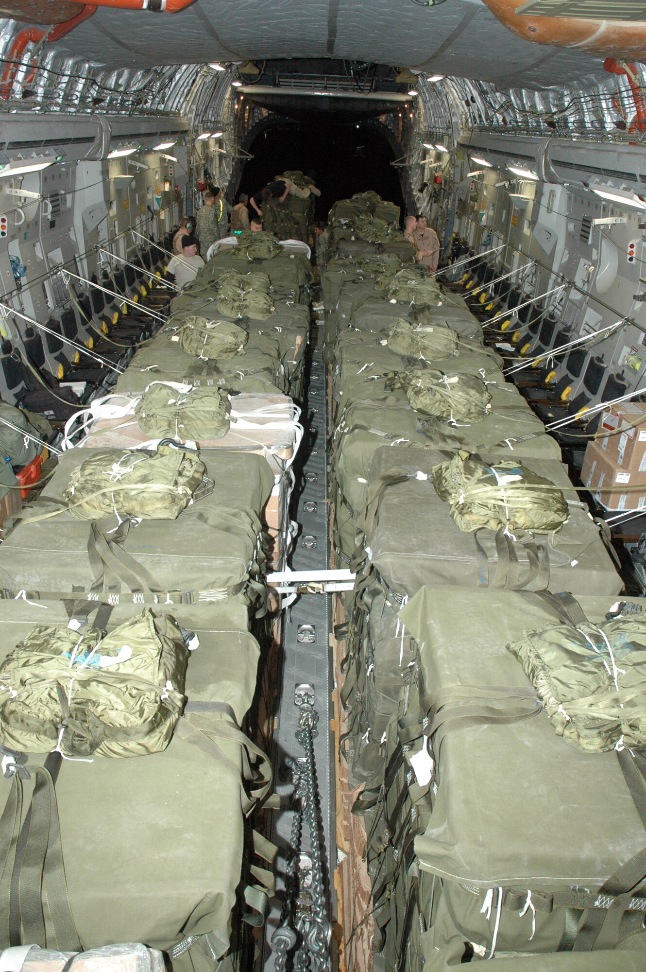 An 816th Expeditionary Airlift Squadron aircrew works with Army personnel in Afghanistan to rig a C-17 for an airdrop mission in February. The squadron has seen an increase in airdop missions during its rotation. (U.S. Air Force photo/Senior Airman Erik Hofmeyer)