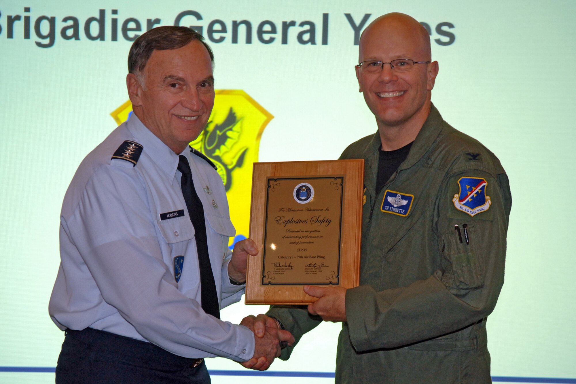 Gen. William Hobbins, United States Air Forces in Europe commander, presents Col. "Tip" Stinnette, 39th Air Base Wing commmander, with the Air Force Explosives Safety.  The 39th Air Base Wing recently won two Air Force-level awards. The two annual awards, the Air Force Surety Plaque and the Air Force Explosives Safety Plaque, are some of the highest awards a base can win for safety achievements.  (U. S. Air Force photo by Airman 1st Class Marc Lane)