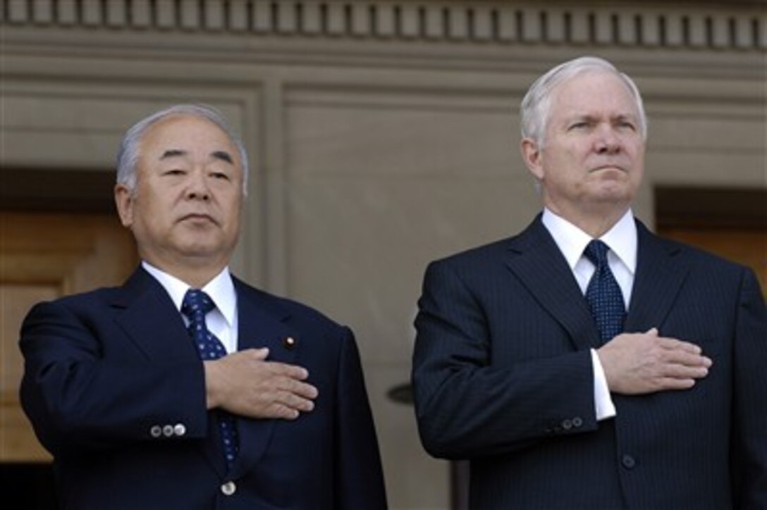 Defense Secretary Robert M. Gates and Japanese Minister of Defense Fumio Kyuma pay respects during the playing of the Japanese and American national anthems during an honor cordon ceremony at the Pentagon, April 30, 2007.