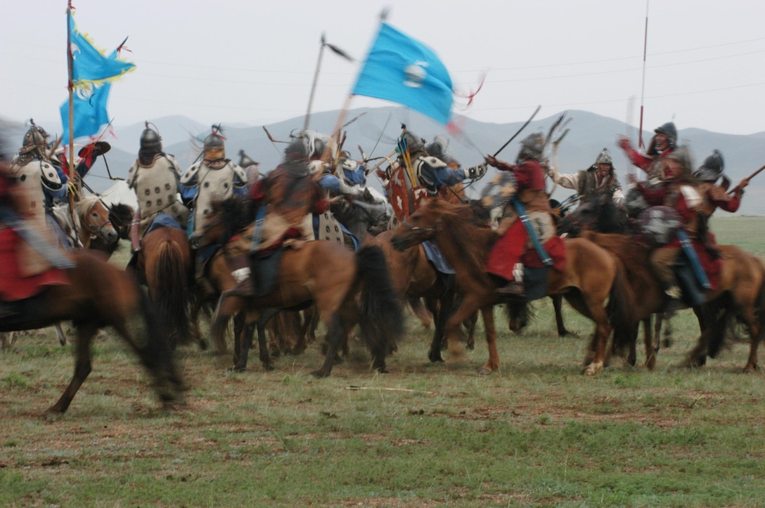 FIVE HILLS TRAINING CENTER, Mongolia (Aug. 1, 2007) â??The Mongolian Armed Forces clash during a mock horse-mounted battle during the opening ceremony of Khaan Quest 07 here Aug. 1. This nomadic country is hosting the multinational peacekeeping exercise for the second year in a row. (Official U. S. Marine Corps photo by Sgt. G. S. Thomas)