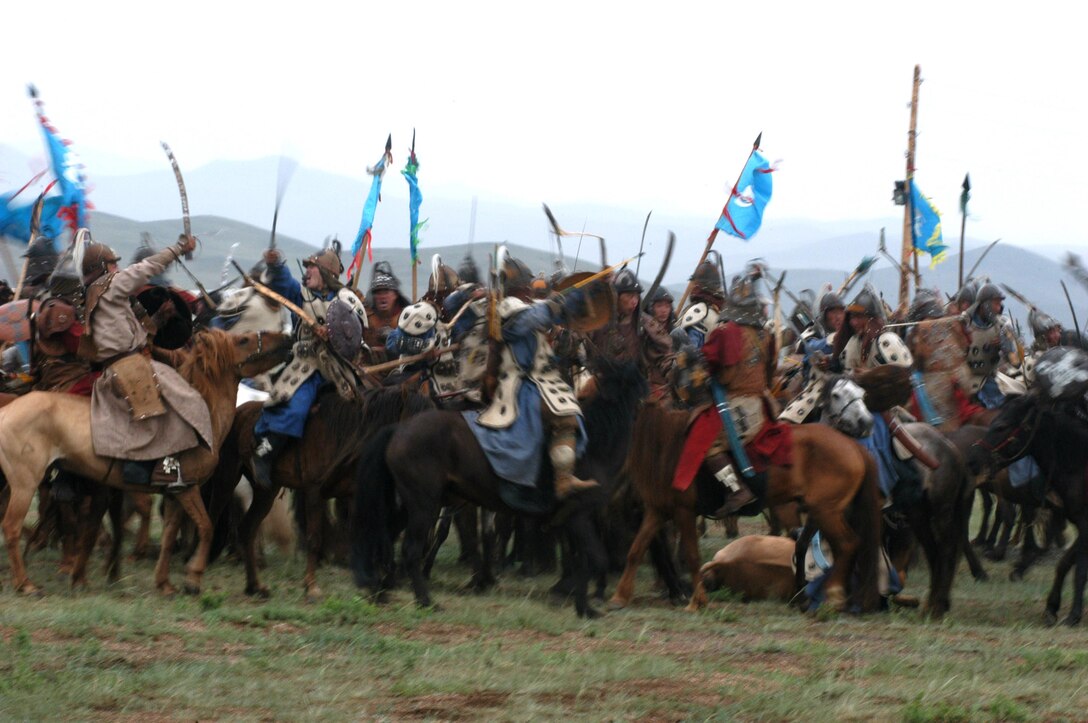 FIVE HILLS TRAINING CENTER, Mongolia (Aug. 1, 2007) â??The Mongolian Armed Forces clash during a mock horse-mounted battle during the opening ceremony of Khaan Quest 07 here Aug. 1. This nomadic country is hosting the multinational peacekeeping exercise for the second year in a row. (Official U. S. Marine Corps photo by Sgt. G. S. Thomas)