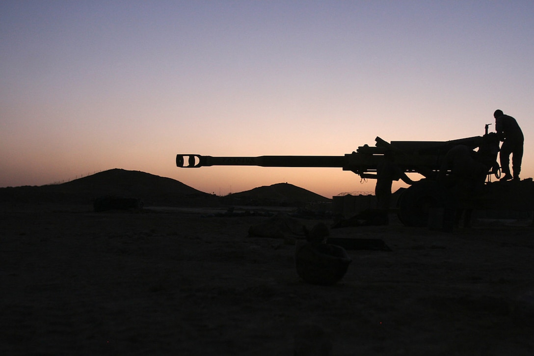 COMBAT OUTPOST RAWAH, IRAQ – A Marine with Battery R, 5th Battalion, 11th Marine Regiment, attached to Task Force Highlander, Regimental Combat Team 2, checks Phyxius, an M198 Howitzer artillery cannon, before an illumination mission. Phyxius is known in Greek mythology as the god of flight. Official Marine Corps Photo By Cpl. Ryan C. Heiser.