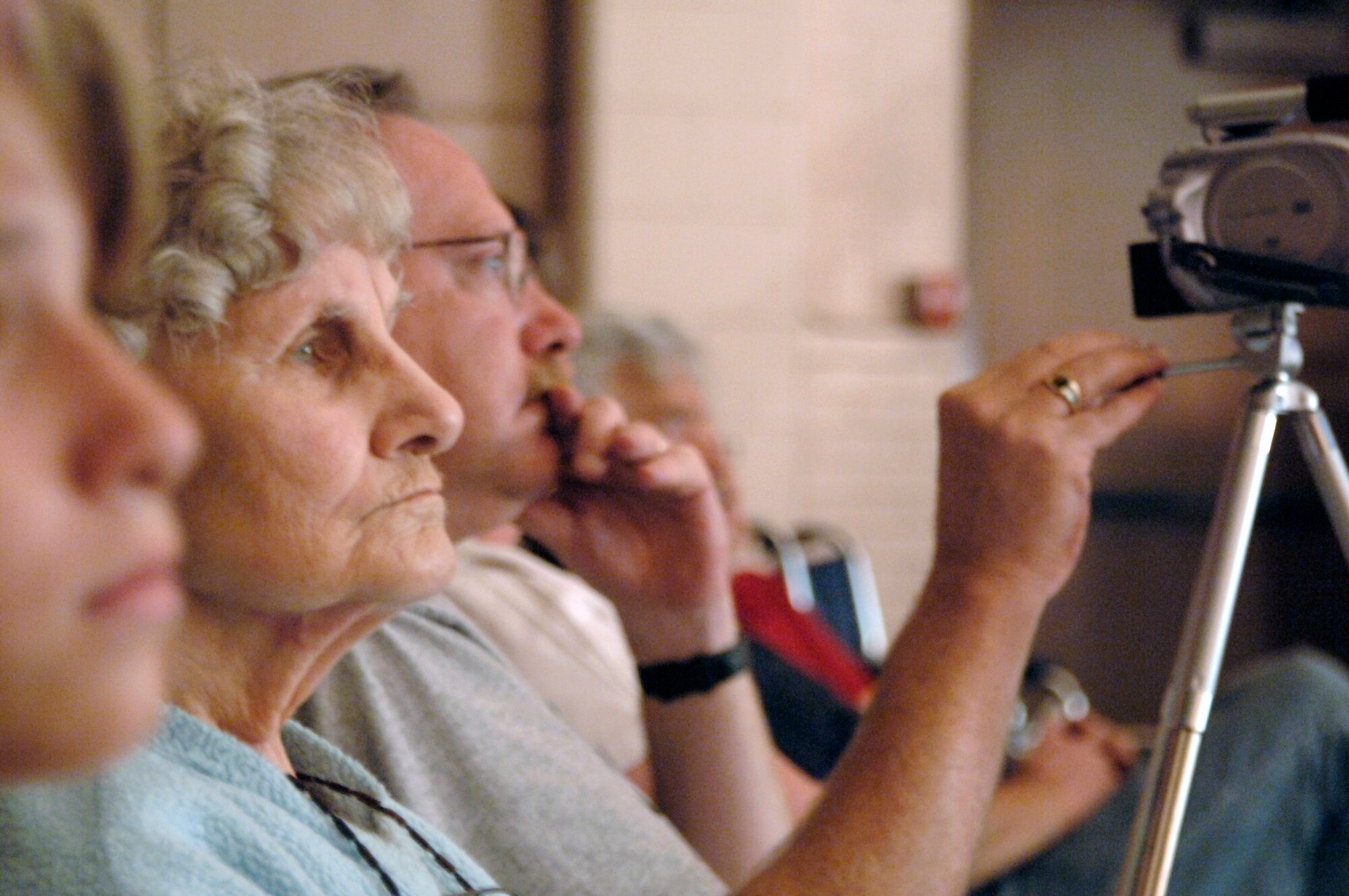 MCCONNELL AIR FORCE BASE, Kan. -- Virginia Halpin, mother of Col. Donald J. Halpin, 22nd Air Refueling Wing Commander, watches her granddaughter Margaret Halpin, 9, perform in a production of "The Little Mermaid" musical July 14 at the base theater. The musical was produced by the Missoula Children's Theater and performed by Team McConnell youths who only had a week of training before the play. (Photo by Tech. Sgt. Chyrece Campbell)