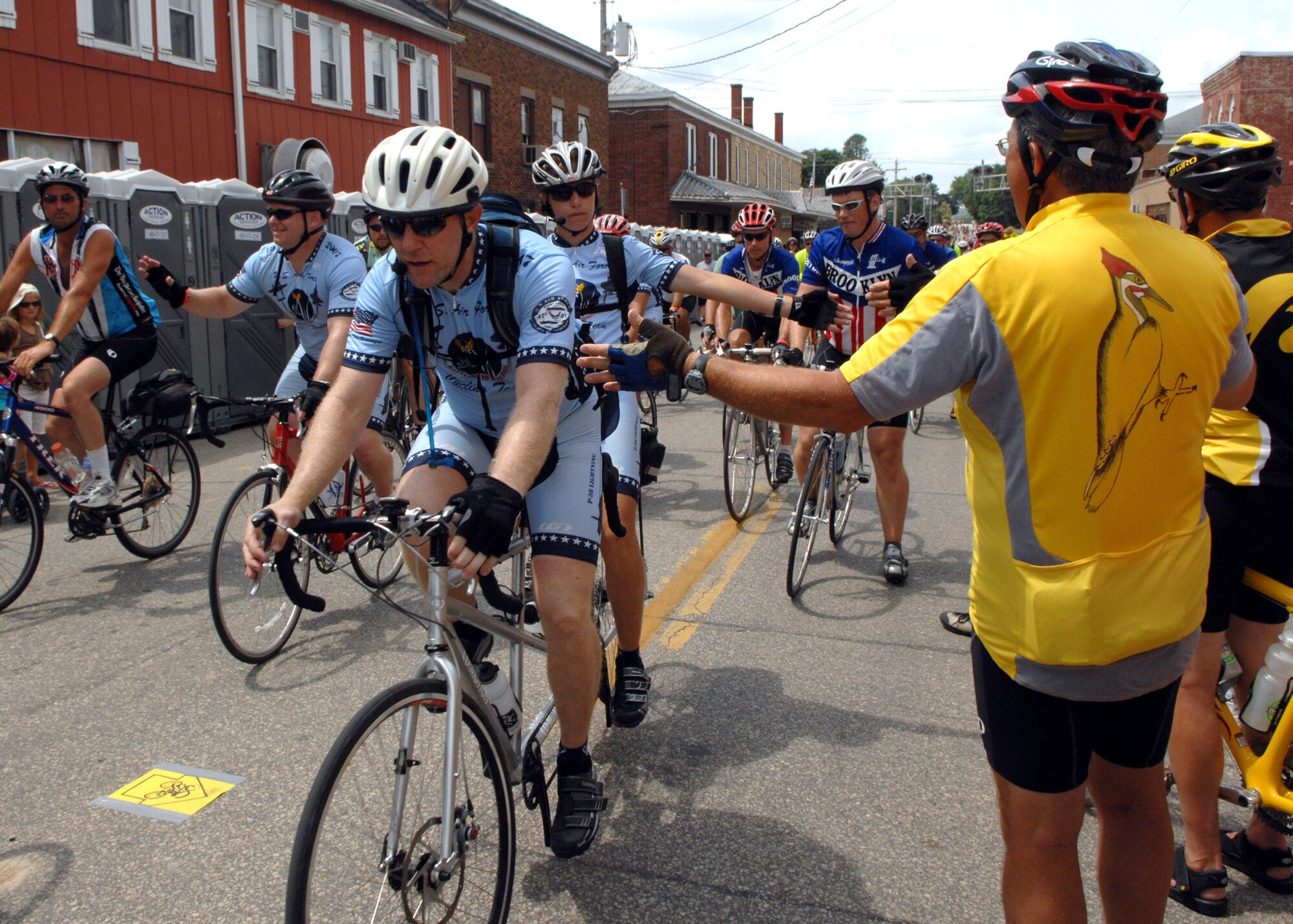 Members of the Air Force Cycling Team are greeted by residents of Bellevue, Iowa, and other participants as they complete the Des Moines Register's Annual Great Bicycle Ride Across Iowa, or RAGBRAI, July 28. The 148 Air Force team members completed seven days of riding, maintaining an average of 70 miles a day, across the state of Iowa to support recruiting efforts and to show Airmen as being fit to fight. (U.S. Air Force photo/Airman 1st Class Joanna M. Kresge)